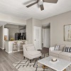 living room with ceiling fan and art on the walls