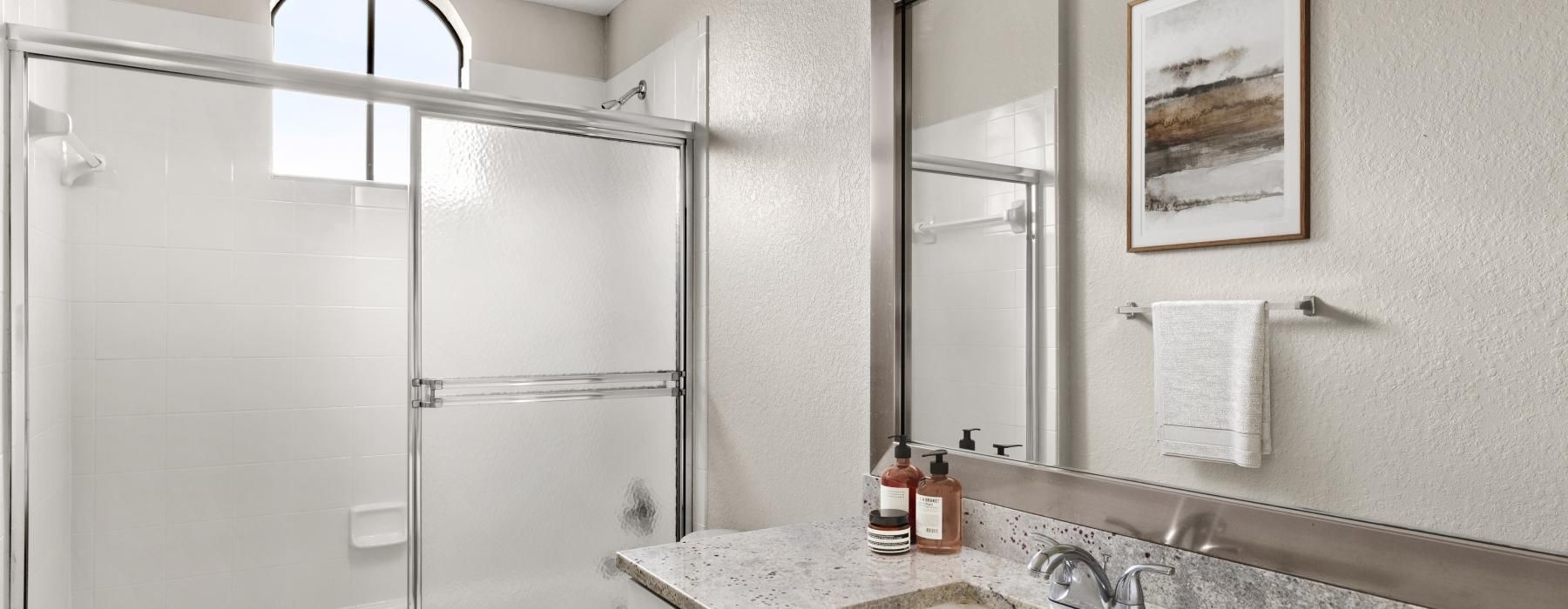 a bathroom with a glass shower