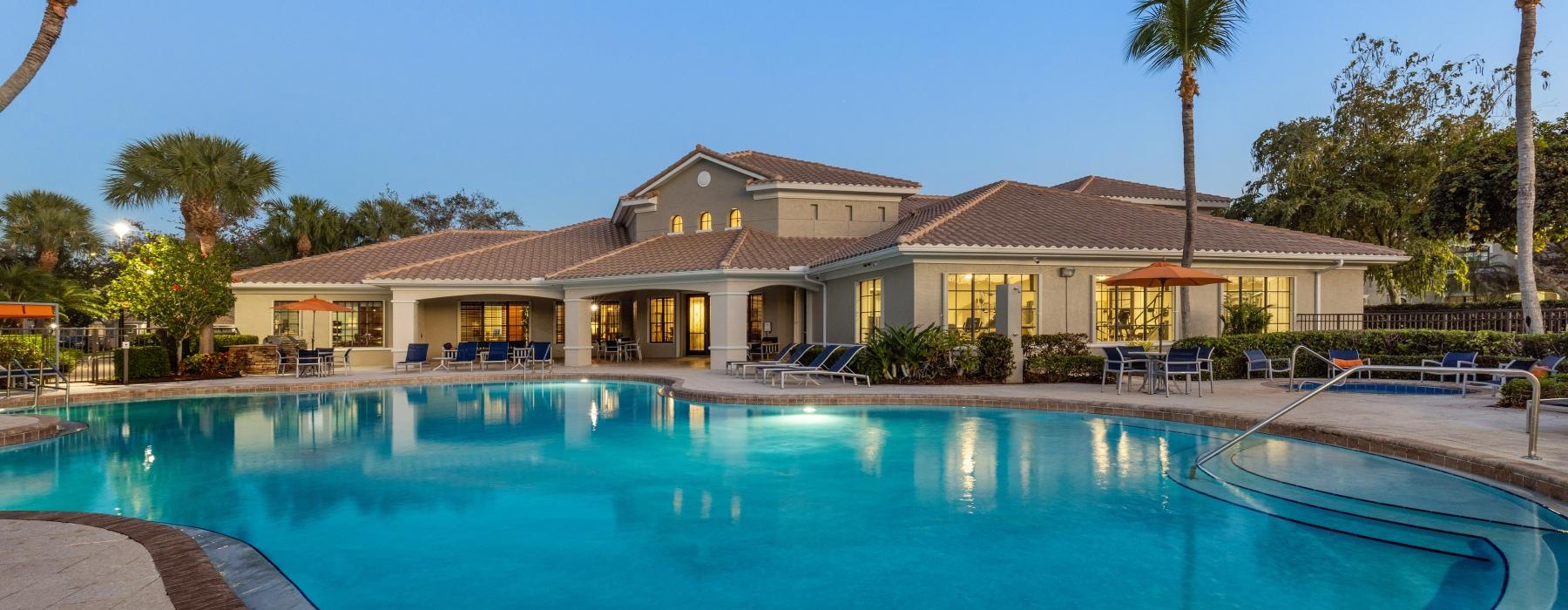 a swimming pool in front of a building